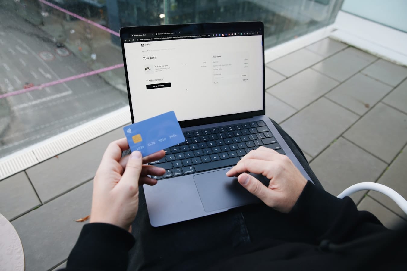 Ebook sales dashboard showing first-month revenue and units sold on a laptop screen