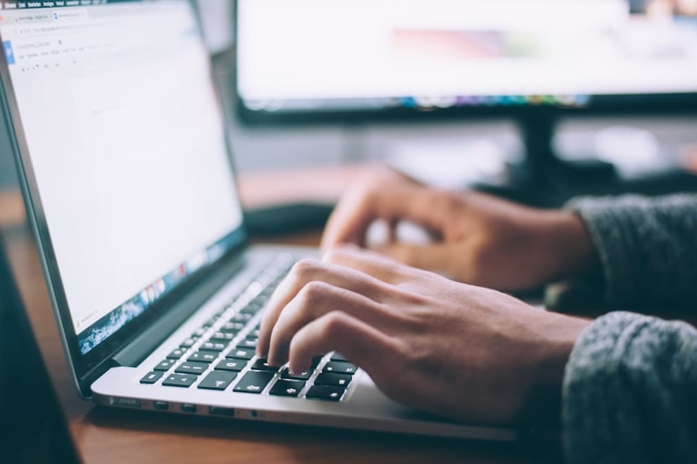 A writer drafting portfolio case studies
