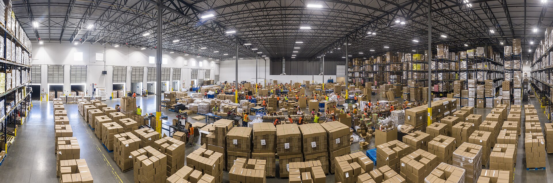 Worker packing product boxes for ecommerce orders