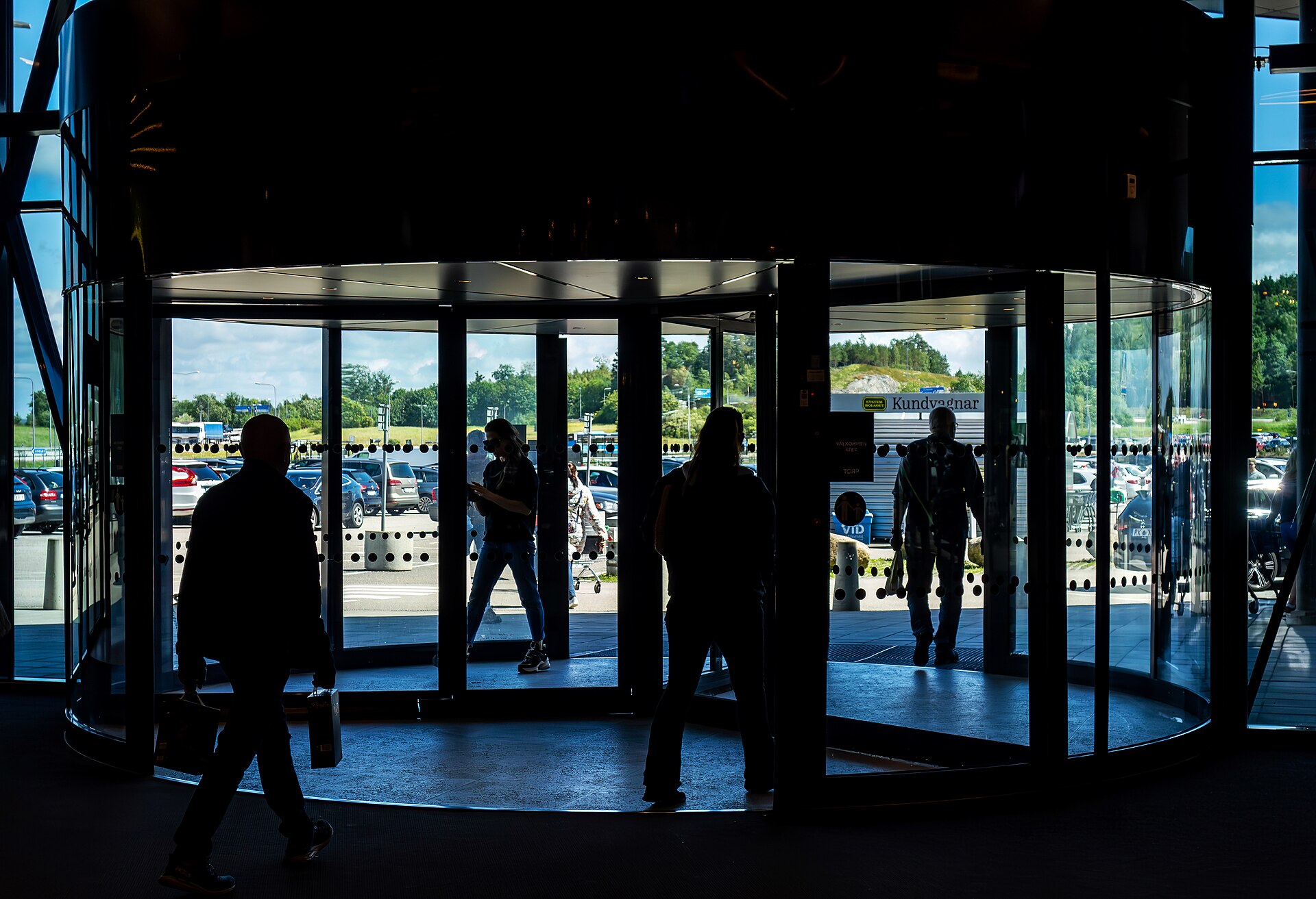 Shoppers walking through a busy retail mall